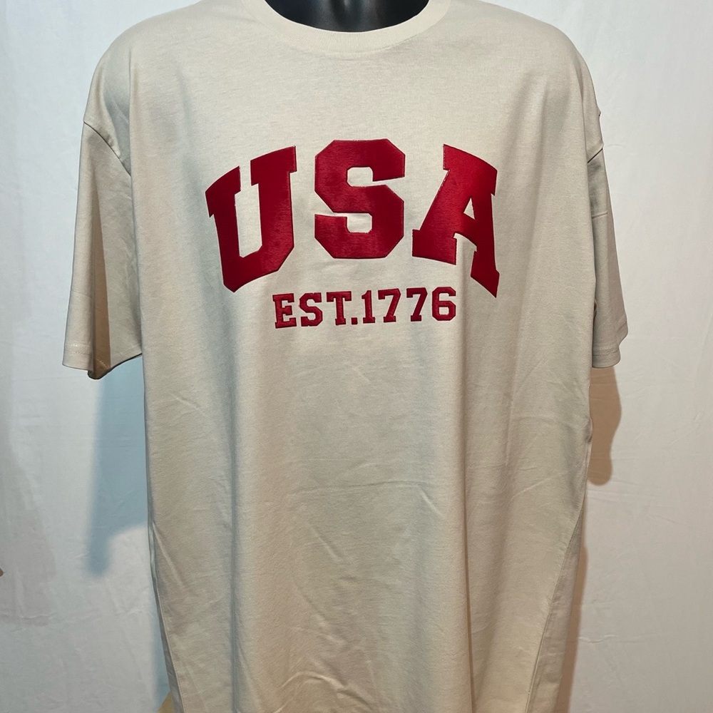 USA 3d plush red graphic on chest with US flag on left sleeve. NWOT